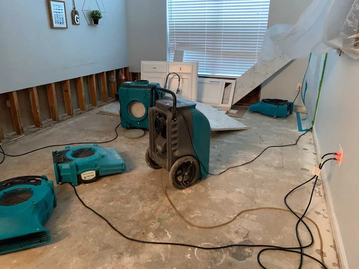 Dehumidifier in flood-cut room for Water Damage Restoration in Honeygo